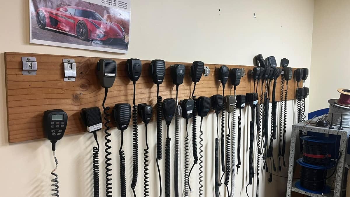 UHF two-way radio handset and antenna setup used across regional Queensland utes, farms and mine sites